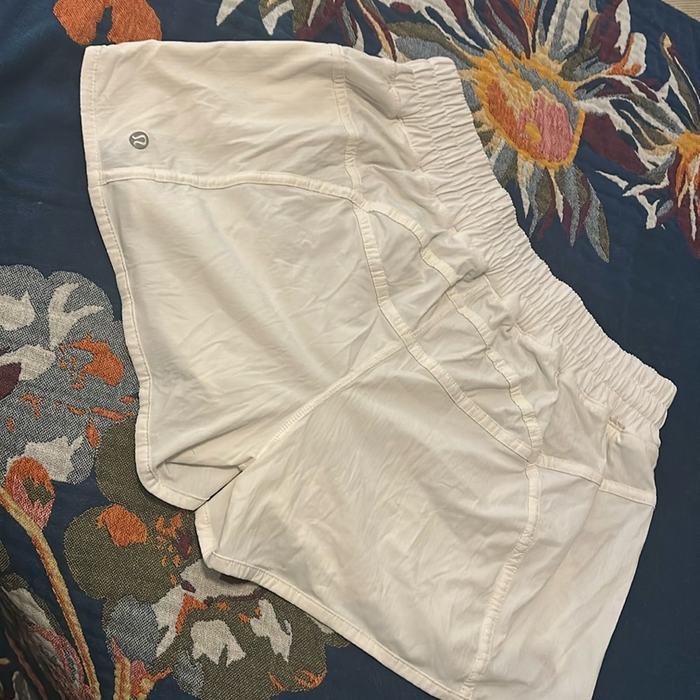 Lululemon white running shorts. Size 10. Never worn.